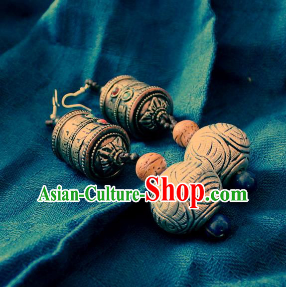 Chinese Handmade Miao Nationality Prayer Wheel Earrings Traditional Minority Ethnic Carving Silver Ear Accessories for Women