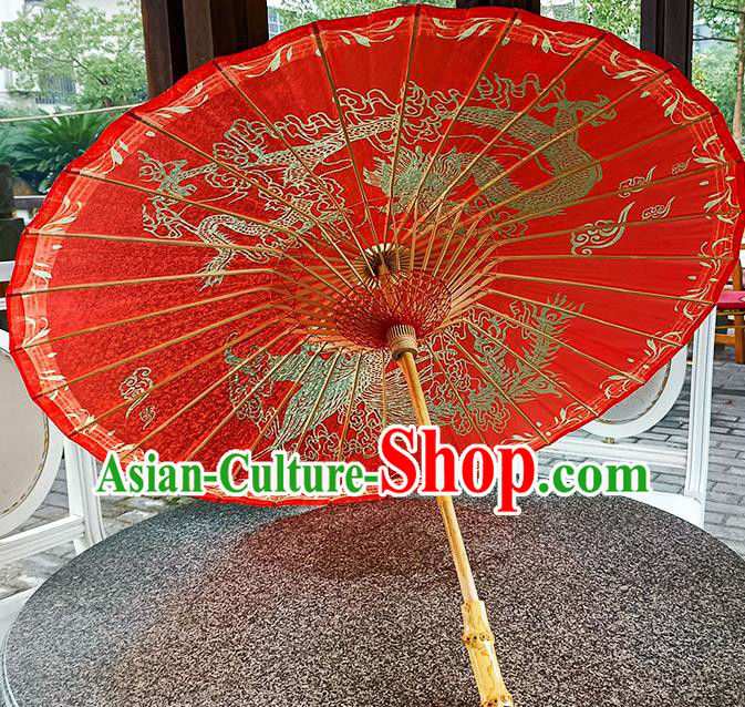 China Classical Wedding Umbrella Hand Painting Phoenix Dragon Umbrella Traditional Red Oilpaper Umbrella Craft China Classical Wedding Umbrella Hand Painting Phoenix Dragon Umbrella Traditional Red Oilpaper Umbrella Craft