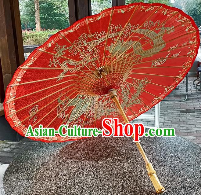 China Classical Wedding Umbrella Hand Painting Phoenix Dragon Umbrella Traditional Red Oilpaper Umbrella Craft China Classical Wedding Umbrella Hand Painting Phoenix Dragon Umbrella Traditional Red Oilpaper Umbrella Craft